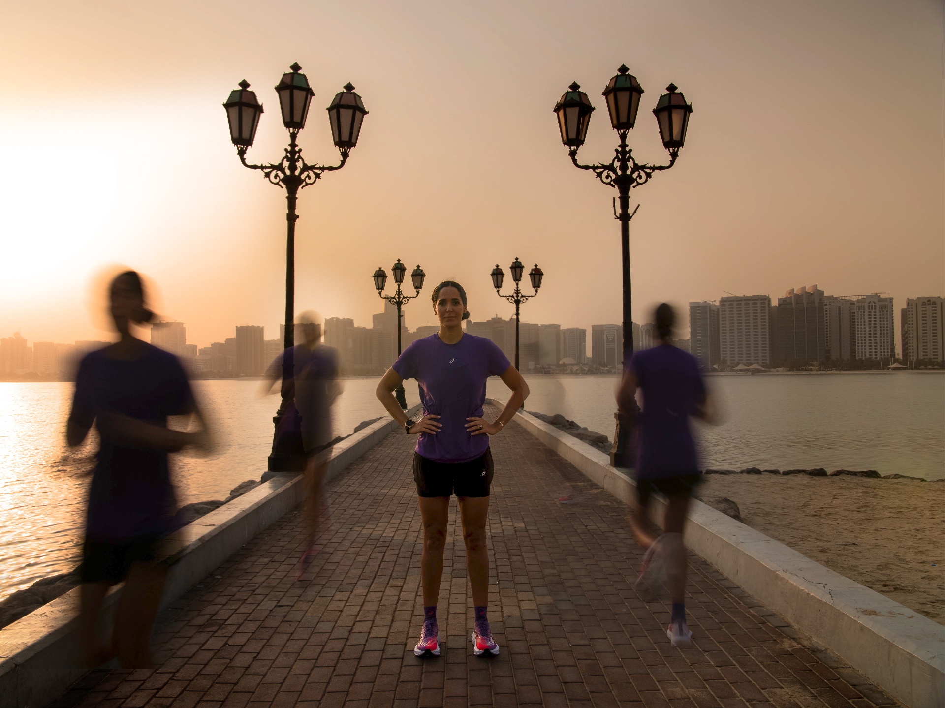 Dr Sarra Lajnef-Taylor with runners on the Abu Dhabi Corniche at sunrise